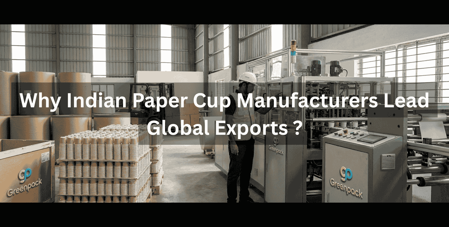 A worker operating paper cup manufacturing machinery in a Greenpack factory facility.