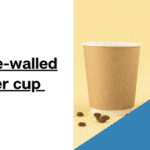 Double wall paper cups with coffee beans on yellow background